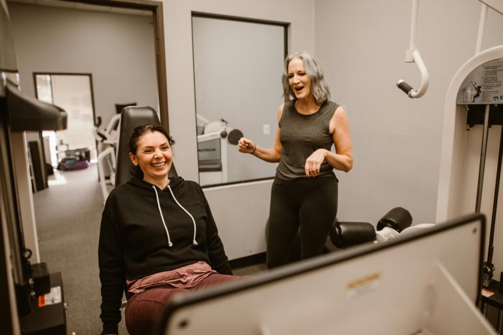 pexels-photo-6539802-6539802 Two women enjoying a workout session indoors, promoting health and wellness.