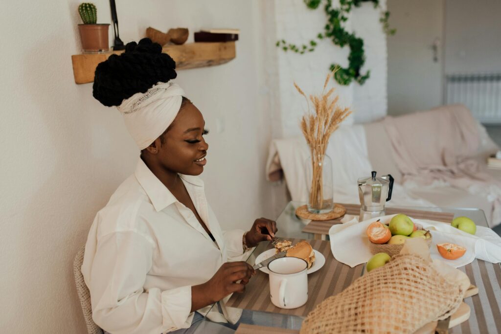 pexels-photo-7005226-7005226 An adult woman enjoying a healthy breakfast in a stylish and cozy home interior.