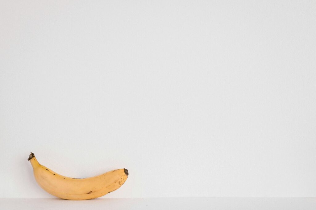 pexels-photo-1166648-1166648 A single yellow banana against a clean white background. Perfect for minimalist designs.