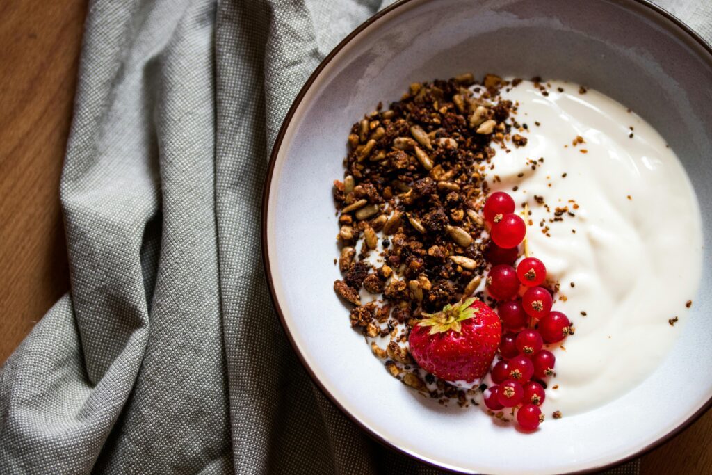pexels-photo-2835751-2835751 Delicious breakfast bowl featuring yogurt, granola, strawberry, and red currants, perfect for a healthy start.